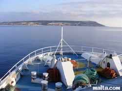 Onboard of the gozo ferry and Malta in the background.JPG