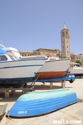 Boat yard in front of the Church of St Anne in Marsascala
