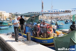 Fishermen in the Marsaxlokk's harbour