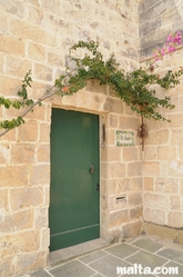 Traditional house door and Bugainvillea in Zurrieq