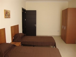 Modern twin bedroom of Belmont Court Qawra