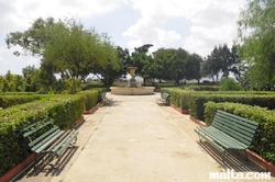Alley and bench in the Argotti Botanical park in Floriana
