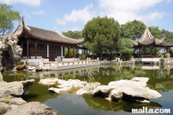 lake and grand hall of the Garden of Serenity in Santa Lucija