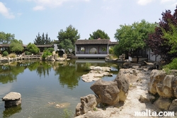 Lake, rocks and front temple of the Garden of Serenity in Santa Lucija