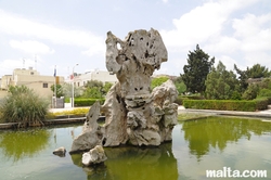 Limestone rock in a fountain of the Garden of Serenity in Santa Lucija