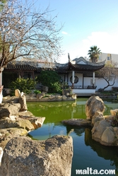 The lake and the rocks of the garden of Serenity in Santa Lucija