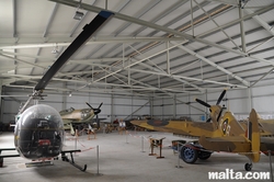 Fighters and helicopter in the Malta Aviation Museum