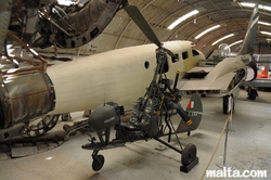 Small helicopter and plain in the Malta Aviation Museum