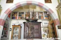 Archives and st Jean Statue in the Archives Room of the Casa Rocca Piccola in valletta