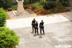 marching guards in the Grandmaster Palace in Valletta marching guards in the Grandmaster Palace in Valletta