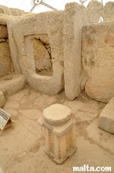 Pierced rock and small monument inside the Hagar Qim Temples Pierced rock and small monument inside the Hagar Qim Temples