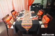 Temptasian restaurant sliema red coloured table