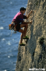 abseiling on the cliffs over the sea in Malta