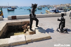 Fisherman statue in marsaxlokk Fisherman statue in marsaxlokk