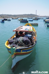 Fishing luzzu in the Marsaxlokk's harbour