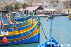 Luzzus onshore in the marsaxlokk harbour Luzzus onshore in the marsaxlokk harbour