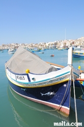 Traditional Luzzu boat in Marsaxlokk Traditional Luzzu boat in Marsaxlokk