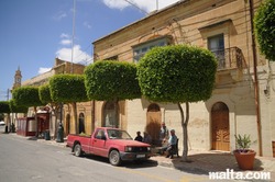 old men resting on benches in nadur gozo