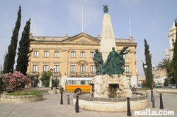 Zabbar's Centre of St Bernardetta and wart memorial in front