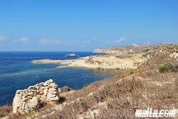 Cliff and beach near Mgarr