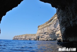 Under the cliff by boat