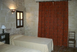 Twin bedroom at ta lonza farmhouse