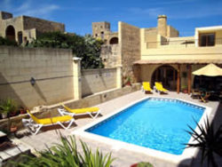 Swimming pool and deck at Ta Cikka Farmhouse