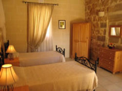 Twin bedroom at Ta Cikka Farmhouse