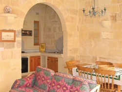 Dining room kitchen living room at ta mananni farmhouse gozo