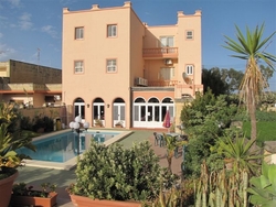 Pool area and garden of Mariblu Hotel