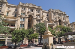 Big building and the fountain in Balluta Bay