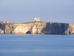 Comino's St. Mary's Tower above the cliff