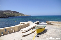 boat and board in dahlet qorrot bay