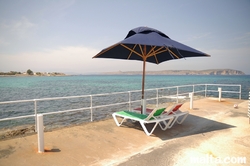 Quiet sun chairs in Armier Bay