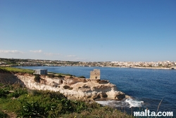 Tower in St Thomas bay and Marsaskala in the distance