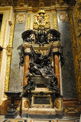 dark tumb and red columns in St. john's cathedral valletta