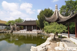 Grand hall, path and lake of the Garden of Serenity in Santa Lucija