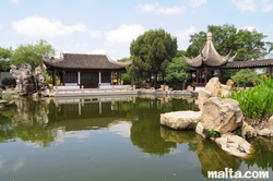 Lake turtles and grand hall of the Garden of Serenity in Santa Lucija