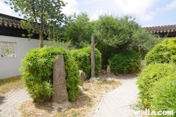 Rocks and plants inside the Garden of Serenity in Santa Lucija