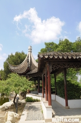 Side path along the lake of the Garden of Serenity in Santa Lucija