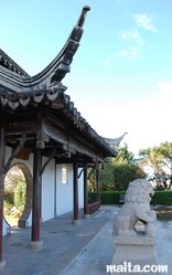 The entrance of the Garden of Serenity in Santa Lucija and a Lion