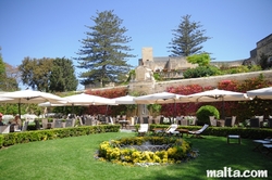 sunbeds and beautiful colours of the palazzo parisio garden