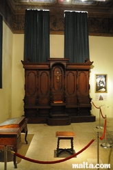 Small Praying monument inside the Inquisitor's Palace of Vittoriosa