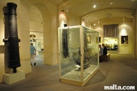 Hall with guns and boats in the Maritime Museum in Victoriosa