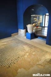 Mosaic floor and amphora in the Domus Romana Museum of Rabat Mosaic floor and amphora in the Domus Romana Museum of Rabat