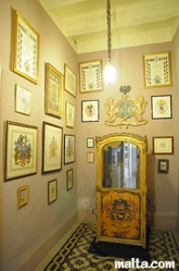 Gilded sedan chair in the Cabinet of the Casa Rocca Piccola in Valletta