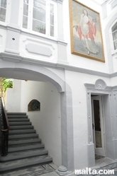 Main gallery room and stairs in the Casa Rocca Piccola in Valletta