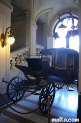 coach in Palazzo Parisio hall