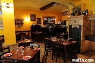 Tables and bar of Ta'Kris Restaurant and Maltese Bistro Tables and bar of Ta'Kris Restaurant and Maltese Bistro